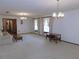 Living room with light walls, hardwood floors, and two chandeliers at 4960 Se 17Th St, Ocala, FL 34471