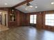 Living room with wood paneling, large windows, and hardwood floors at 4960 Se 17Th St, Ocala, FL 34471