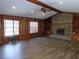 Living room with brick fireplace and wood-paneled walls at 4960 Se 17Th St, Ocala, FL 34471