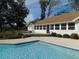 Large kidney shaped pool with wooden deck at 4960 Se 17Th St, Ocala, FL 34471