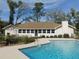 Inviting pool with deck, surrounded by trees at 4960 Se 17Th St, Ocala, FL 34471