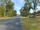 Quiet tree-lined road in a rural setting at 4960 Se 17Th St, Ocala, FL 34471