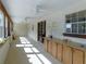 Long screened porch with multiple fans at 4960 Se 17Th St, Ocala, FL 34471