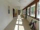 Spacious screened porch with multiple windows at 4960 Se 17Th St, Ocala, FL 34471