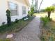 Brick pathway leading to the house, nicely landscaped at 4960 Se 17Th St, Ocala, FL 34471