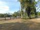Spacious backyard with a wooden fence and lush greenery at 4960 Se 17Th St, Ocala, FL 34471