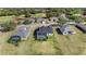 Aerial view of homes with pools at 5141 Greens Dr, Lady Lake, FL 32159