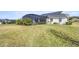 Large backyard with pool and screened enclosure at 5141 Greens Dr, Lady Lake, FL 32159