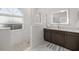 Spa-like bathroom featuring a large walk-in shower and updated fixtures at 5141 Greens Dr, Lady Lake, FL 32159