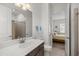 Bathroom with shower, toilet and vanity, with bedroom view at 5141 Greens Dr, Lady Lake, FL 32159