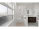 Bright bathroom with a large walk-in shower, a window, and marble tile at 5141 Greens Dr, Lady Lake, FL 32159
