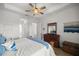 Comfortable bedroom with dresser and ceiling fan at 5141 Greens Dr, Lady Lake, FL 32159