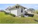 Side view of the house showcasing landscaping and architectural details at 5141 Greens Dr, Lady Lake, FL 32159
