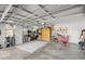 Spacious garage with ample storage and workshop area at 5141 Greens Dr, Lady Lake, FL 32159