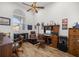 Home office with wooden furniture and a large window at 5141 Greens Dr, Lady Lake, FL 32159