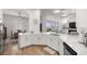 Open concept kitchen with large island and white cabinets at 5141 Greens Dr, Lady Lake, FL 32159