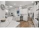 Modern kitchen with white cabinets and quartz countertops at 5141 Greens Dr, Lady Lake, FL 32159