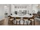 Large kitchen with island, white cabinets, and stainless steel appliances at 5141 Greens Dr, Lady Lake, FL 32159