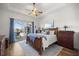 Spacious main bedroom with sliding doors leading to the pool at 5141 Greens Dr, Lady Lake, FL 32159