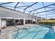 Pool and patio with retractable awnings and a spacious backyard at 5141 Greens Dr, Lady Lake, FL 32159