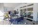 Outdoor patio with seating area, glass table, and pool view at 5141 Greens Dr, Lady Lake, FL 32159