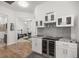 Convenient wet bar with wine fridge and glass storage at 5141 Greens Dr, Lady Lake, FL 32159