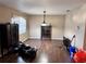 Dining room with hardwood floors and a chandelier at 5574 Nw 61St Ln, Ocala, FL 34482