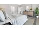 Spacious bedroom with dresser and large bed at 5789 Sw 129Th Place Rd, Ocala, FL 34473