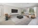 Comfortable living room featuring neutral decor and access to backyard at 5789 Sw 129Th Place Rd, Ocala, FL 34473