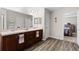 Modern bathroom with double sinks and wood cabinets at 6303 Sw 116Th Street Rd, Ocala, FL 34476