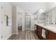 Elegant bathroom with double vanity and a walk-in shower at 6303 Sw 116Th Street Rd, Ocala, FL 34476