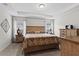 Spacious bedroom with wood furniture and large windows at 6303 Sw 116Th Street Rd, Ocala, FL 34476