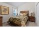 Comfortable bedroom with tropical bedding and nightstands at 6303 Sw 116Th Street Rd, Ocala, FL 34476