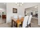 Elegant dining room with wood table and four chairs at 6303 Sw 116Th Street Rd, Ocala, FL 34476