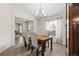 Bright dining area with wood table and four chairs at 6303 Sw 116Th Street Rd, Ocala, FL 34476