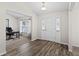 Bright entryway with wood flooring and views to home office at 6303 Sw 116Th Street Rd, Ocala, FL 34476