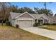 House exterior showcasing a well-maintained lawn and landscaping at 6303 Sw 116Th Street Rd, Ocala, FL 34476