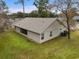Back of house with screened porch and yard at 6303 Sw 116Th Street Rd, Ocala, FL 34476