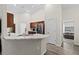 Open kitchen with an island and stainless steel appliances at 6303 Sw 116Th Street Rd, Ocala, FL 34476