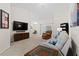 Spacious living room with large TV and sectional sofa at 6303 Sw 116Th Street Rd, Ocala, FL 34476
