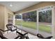 Relaxing screened porch overlooking backyard at 6303 Sw 116Th Street Rd, Ocala, FL 34476