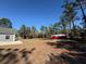 Large backyard with shed, and firepit area at 7749 Sw 128Th Terrace Rd, Dunnellon, FL 34432