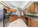 Modern kitchen with stainless steel appliances and wood cabinets at 801 Nw 75Th Ter, Ocala, FL 34482