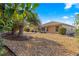 Landscaped backyard with gravel and patio area at 8125 Sw 81St Loop, Ocala, FL 34476