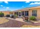 Relaxing patio with seating area, grill, and shade awning at 8125 Sw 81St Loop, Ocala, FL 34476