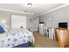 Bedroom with a queen-size bed and built-in workspace at 8125 Sw 81St Loop, Ocala, FL 34476