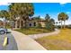 Community clubhouse with inviting landscaping and walkway at 8125 Sw 81St Loop, Ocala, FL 34476
