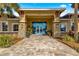 Elegant community clubhouse entrance with stone accents at 8125 Sw 81St Loop, Ocala, FL 34476