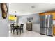 Cozy breakfast nook with yellow curtains and wood table at 8125 Sw 81St Loop, Ocala, FL 34476