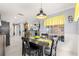 Bright dining area with lemon-themed decor and wood table at 8125 Sw 81St Loop, Ocala, FL 34476